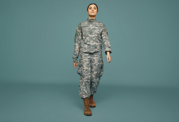 Patriotic army soldier marching in a studio