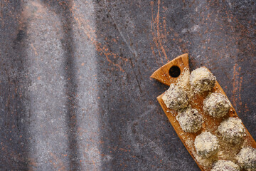 Handmade sweets candies on a rusty metal table for dessert and treat. Homemade sweets.