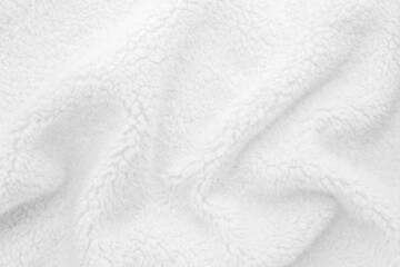 White wavy lambswool texture close up. Warm sheep's wool fabric for blankets. Lining for winter knitted plaid - obrazy, fototapety, plakaty