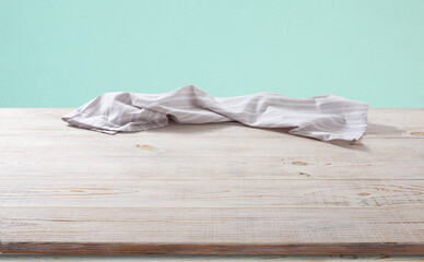 White napkin, table cloth on wooden deck mockup.