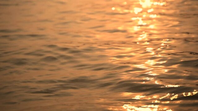 Reflection of sunlight over Ganges river surface in slow motion at Varanasi India