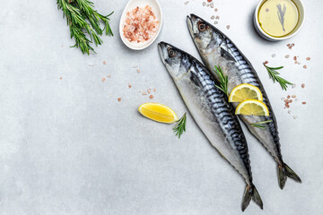 scomber, marinated mackerel or herring fish with salt, lemon and spices on a light background....