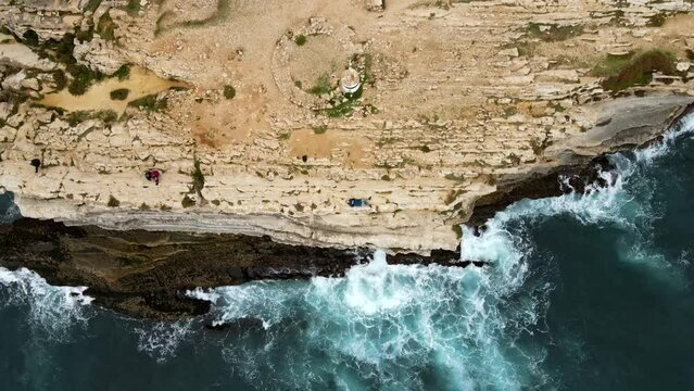 Aerial view of island Baleal naer Peniche on the shore of the ocean in west coast of Portugal. Baleal Portugal with incredible beach and surfers