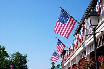 Profuse American patriotic decorations with flags bunting and garlands in the nation's colors on...
