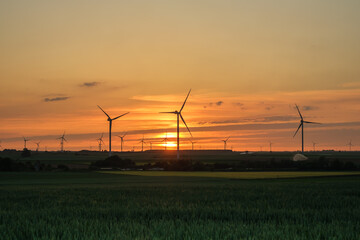 Wind turbines and an amazing golden sunset in Heron Belgium