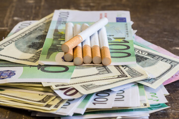 Cigarettes with a filter on banknotes. The rise in food prices in Ukraine due to the war