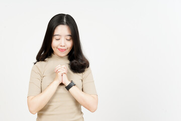 Praying Gesture Of Beautiful Asian Woman Isolated On White Background