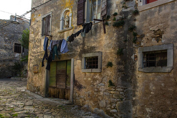 Fototapeta na wymiar An old residential building in the historic medieval hill village of Buzet in Istria, western Croatia 