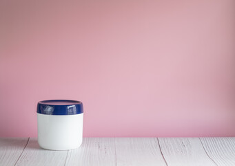 Container of diaper rash ointment for baby with copy space for text. Baby skin care.