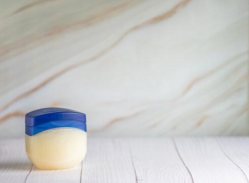 Big container of cream vaseline with copy space for text