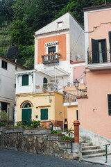 Fototapeta na wymiar Сozy little town on the Amalfi Coast - Cetara. Lovely old traditional courtyards with stairs.