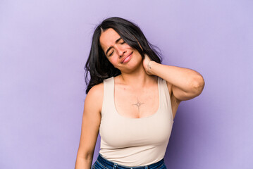 Young hispanic woman isolated on purple background massaging elbow, suffering after a bad movement.