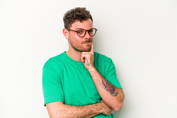 Young caucasian man isolated on white background contemplating, planning a strategy, thinking about the way of a business.