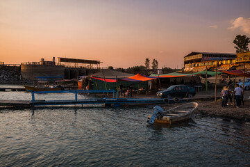 Fototapeta premium Boat landing with tents and vendors Mexico