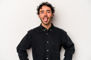 Young caucasian man isolated on white background funny and friendly sticking out tongue.