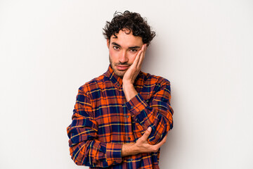 Young caucasian man isolated on white background who is bored, fatigued and need a relax day.