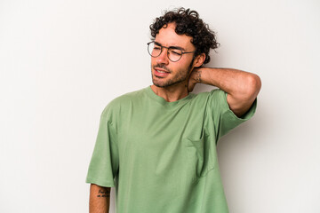 Young caucasian man isolated on white background tired and very sleepy keeping hand on head.