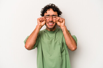 Young caucasian man isolated on white background whining and crying disconsolately.