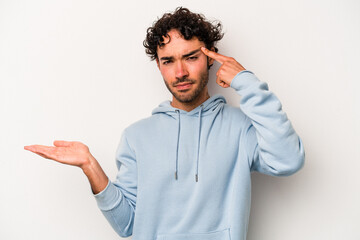 Young caucasian man isolated on white background showing a disappointment gesture with forefinger.