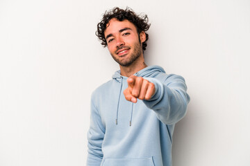 Young caucasian man isolated on white background cheerful smiles pointing to front.