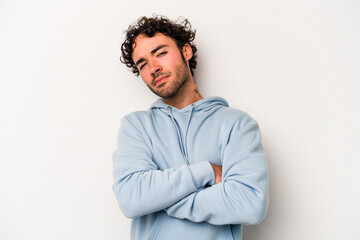 Obraz premium Young caucasian man isolated on white background tired of a repetitive task.