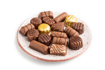 Chocolate candies isolated on white background. side view, close up.