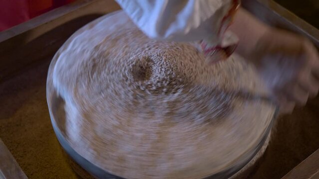 The millstones are spun and ground wheat flour. Vintage millstones