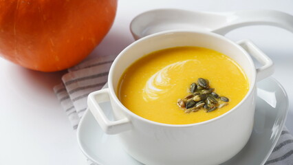Creamy pumpkin soup with bacon. Healthy organic pumpkin cream soup
