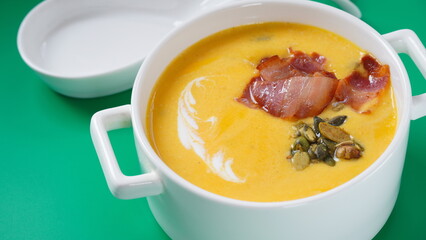 Creamy pumpkin soup with bacon. Healthy organic pumpkin cream soup