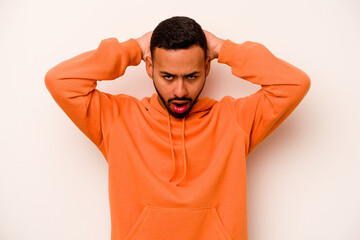 Young hispanic man isolated on white background screaming, very excited, passionate, satisfied with...