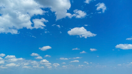 Cirrus clouds in a bright blue summer sky. White light clouds in a clear sky. Shooting from a drone. Shooting with a quadcopter
