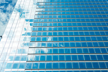 Fototapeta na wymiar underside panoramic and perspective view to steel blue glass high rise building skyscrapers