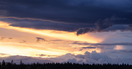 View of Cloudscape during a colorful sunset or sunrise. Taken on the West Coast of British Columbia, Canada. Nature Background