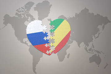 puzzle heart with the national flag of russia and republic of the congo on a world map background. Concept.