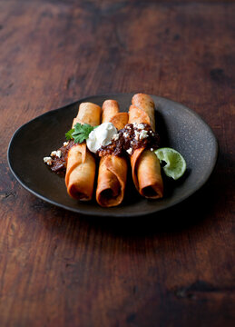 Flautas with Mole and Sour Cream