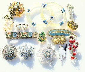 Collection display of vintage jewelry brooches bracelets earrings costume jewelry accessory