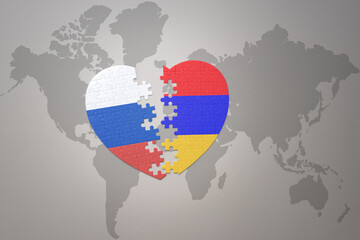 puzzle heart with the national flag of russia and armenia on a world map background. Concept.