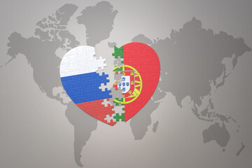 puzzle heart with the national flag of russia and portugal on a world map background. Concept.