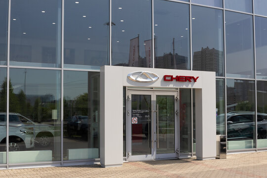 Krasnoyarsk, Russia - May 19, 2022: entrance to Chery dealership store. Showroom of a brand. Chinese state-owned automobile manufacturer