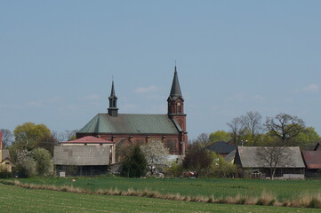 Fototapeta na wymiar Parish Church of the Exaltation of the Holy Cross. Kozlow (Miechowski) is village in Lesser Poland Voivodeship. 
