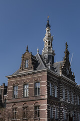 Fototapeta na wymiar Architectural fragments of old Amsterdam building: XIX century Neo-Renaissance-style building, former Town Hall and Archive of Amstel Community Amsterdam, The Netherlands.
