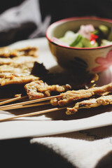 Pork satay served in the morning in the sunshine.