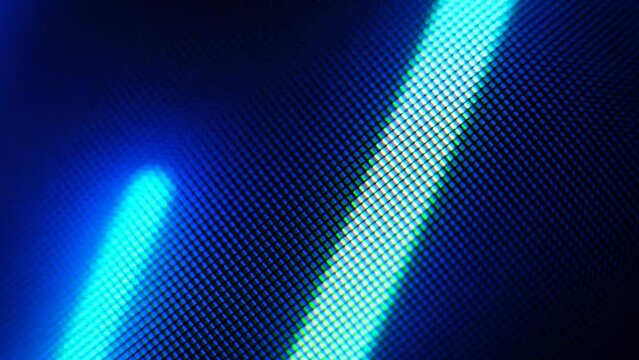 Abstract motion of blue stripes of bright pixels on a dark background, close-up, soft focus