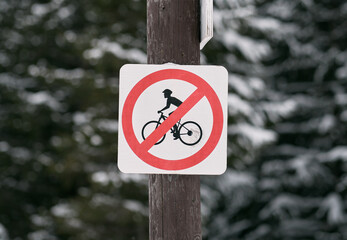 No bicycles allowed sign. Road sign prohibits using bikes on a trail. Limitation od outdoors...