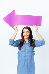 Happy smiling young woman holding over her head big paper