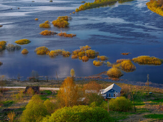 Beautiful views of a small house on the river bank