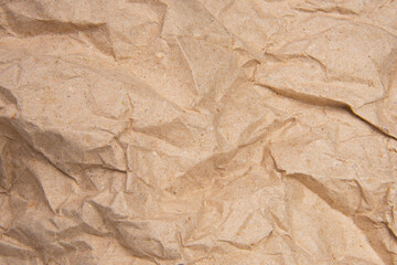 Crumpled brown paper craft textured background