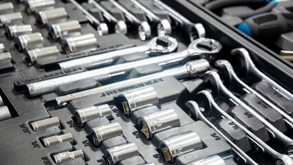 Ratchet head tool set for car repair. Universal set of tools for car repair on a wooden background. Car repair, auto and motorcycle workshop.