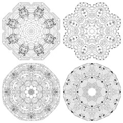 Hand drawn zentangle set of 4 mandalas for coloring page.