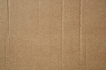 Background with a brown cardboard texture pattern. Blank cardboard background